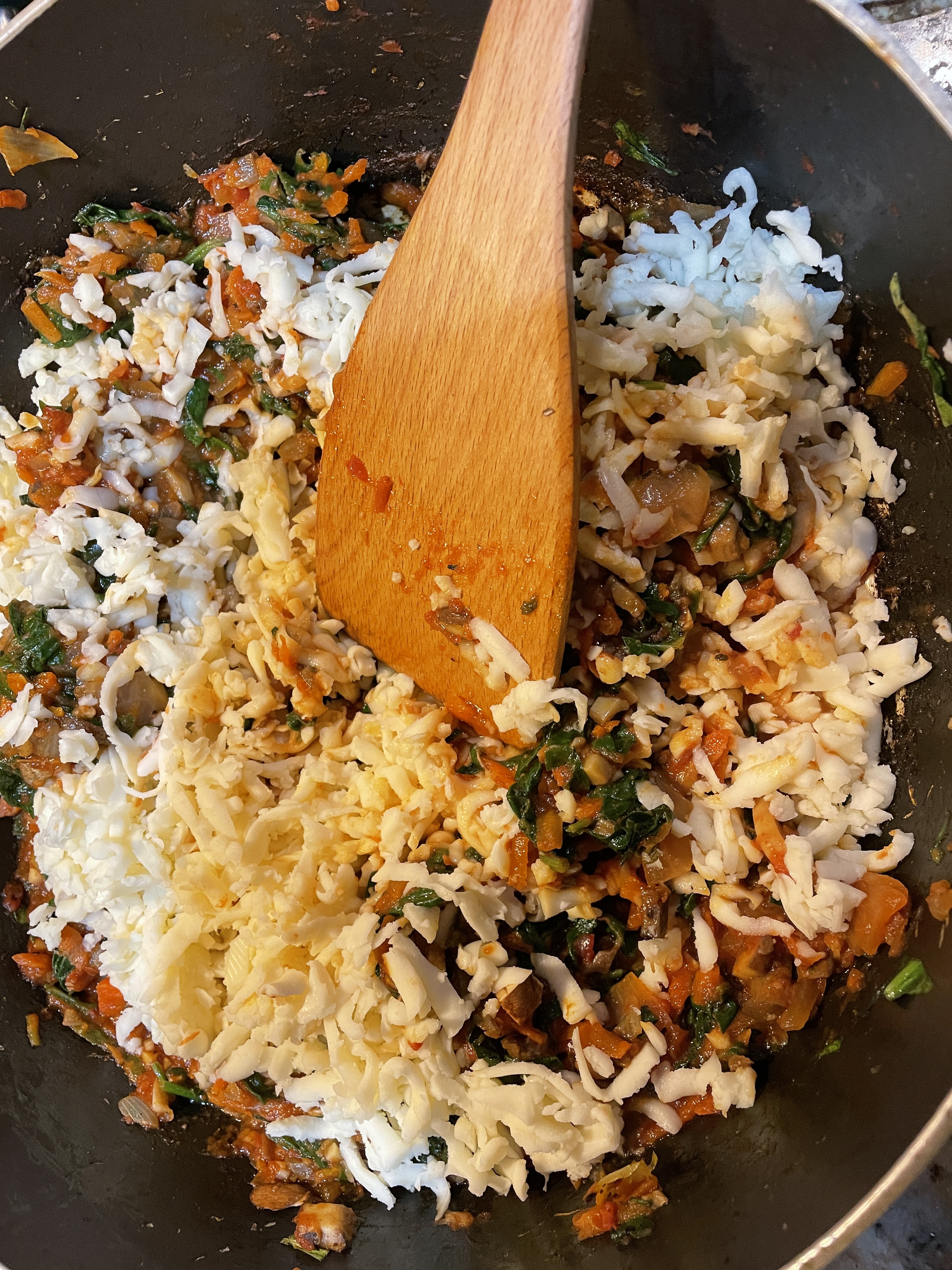 Add loads of mozzarella and parmesan